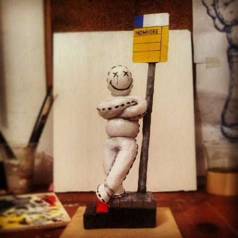 Damian Tab sculpture Nowhere 2014 sculpey and acrylic character leaning on street sign