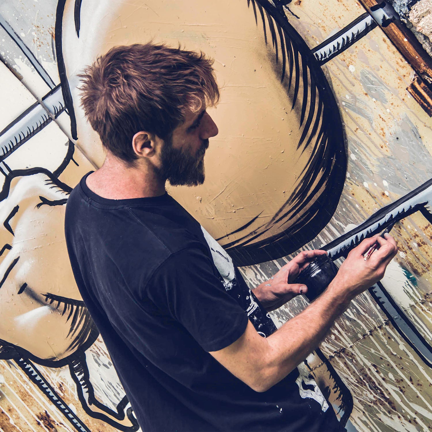 Damian Tab painting street art in Tivon 2019 spray painting mural in urban environment