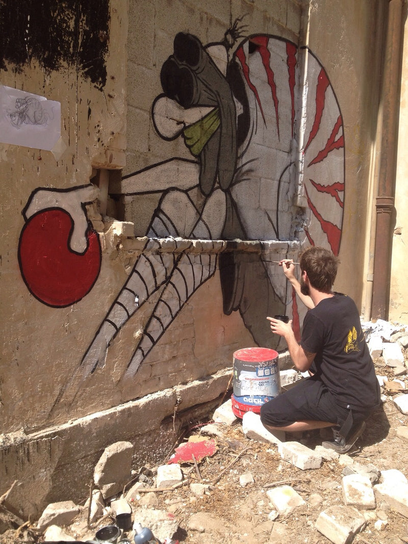 Damian Tab painting street art mural in Tel Aviv